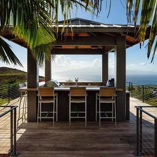 Island style backyard patio kitchen photo in Hawaii with decking and a gazebo