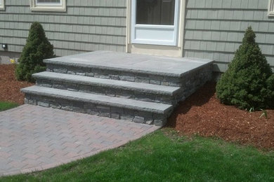 Inspiration for a patio in Providence with brick paving.