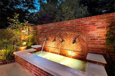 Patio fountain - traditional backyard patio fountain idea in Houston