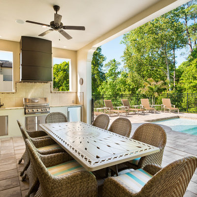 Transitional patio photo in Orlando with a roof extension