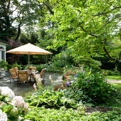Patio - large traditional backyard concrete paver patio idea in Boston with no cover