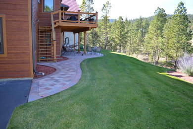 Patio - mid-sized craftsman backyard concrete paver patio idea in Other