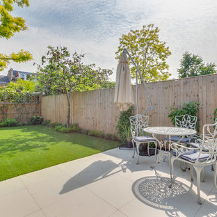 Photo of a medium sized contemporary back patio in London.