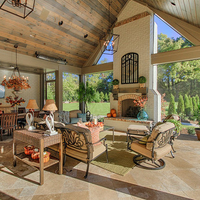Patio - huge rustic patio idea in Other with a fire pit and a roof extension