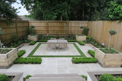 Design ideas for a contemporary patio in Surrey.