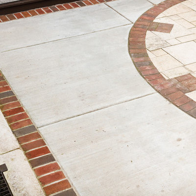 Example of a small classic backyard stone patio design in Milwaukee