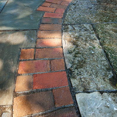 Patio - mid-sized traditional backyard stone patio idea in Milwaukee