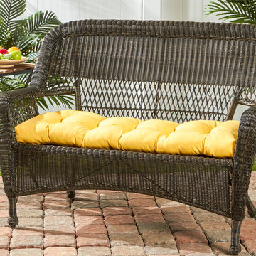 Wicker Loveseat with a Bright Yellow Cushion