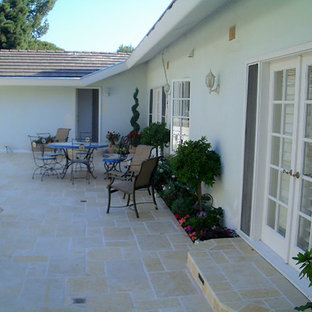 Inspiration for a mid-sized shabby-chic style backyard tile patio kitchen remodel in Los Angeles