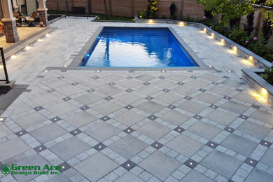 Inspiration for a mid-sized modern backyard concrete paver patio remodel in Toronto