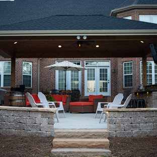 Idee per un patio o portico boho chic di medie dimensioni e dietro casa con cemento stampato