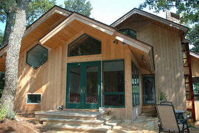 Inspiration for a mid-sized craftsman side yard patio remodel in Raleigh with decking