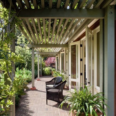 Inspiration for a timeless brick patio remodel in San Francisco with a pergola