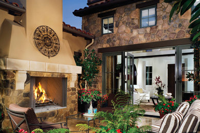 Patio - traditional patio idea in Orange County with a fire pit