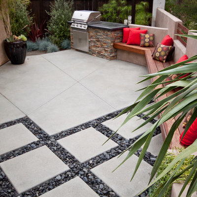 Patio kitchen - small contemporary backyard concrete paver patio kitchen idea in San Diego with no cover
