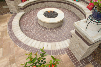 Inspiration for a mid-sized timeless backyard concrete paver patio remodel in Indianapolis with a fire pit