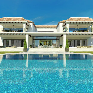 Foto de piscina actual rectangular