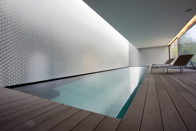 Photo of a contemporary indoor swimming pool in Naples.