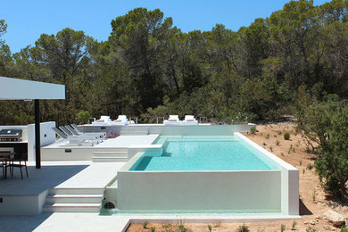 Medium sized modern rectangular lengths swimming pool in Other.