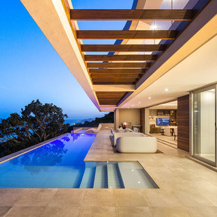 Ispirazione per una piscina minimal a "L" con una dépendance a bordo piscina