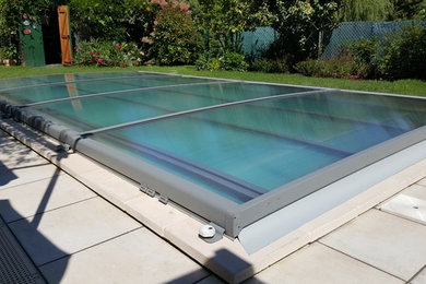 Diseño de casa de la piscina y piscina alargada contemporánea de tamaño medio rectangular