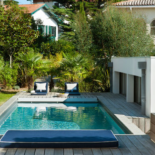 Idee per una piscina stile marino rettangolare dietro casa con pedane