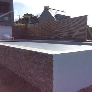 Idee per una grande piscina fuori terra stile marino rettangolare con pedane