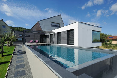 Foto de piscina infinita contemporánea grande rectangular