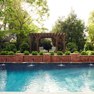 Traditional rectangular pool in Richmond with a water feature.