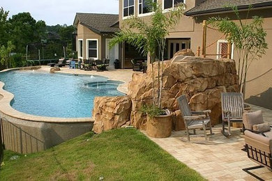 Water slide - large coastal backyard tile and custom-shaped aboveground water slide idea in Orlando