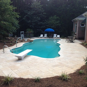 16' X 45' fiberglass pool with travertine decking