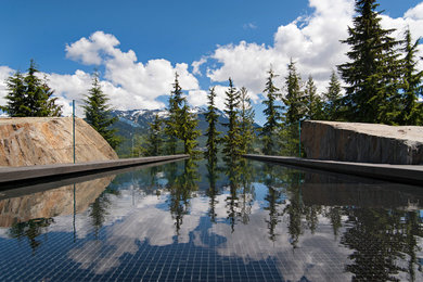 Inspiration for a contemporary rectangular infinity pool remodel in Vancouver