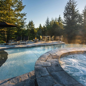 2016 Gold Award winner, vanishing edge concrete pool with spa and water feature