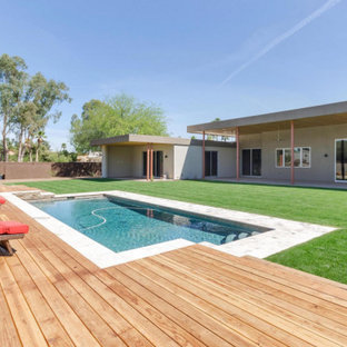 Ispirazione per una piscina minimal rettangolare con pedane