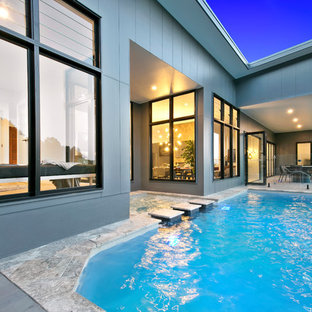 Contemporary backyard custom-shaped pool in Sunshine Coast with a hot tub and tile.