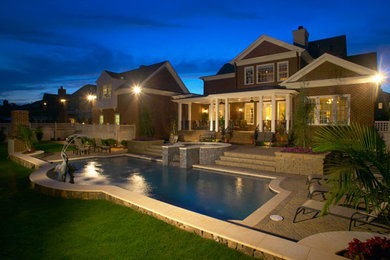 Pool fountain - large traditional backyard concrete paver and rectangular natural pool fountain idea in Charlotte
