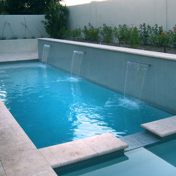 A swimming pool doubles as water feature in this compact backyard space