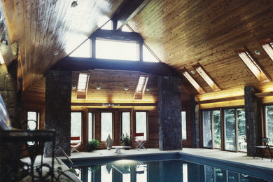 Example of a huge danish indoor tile and rectangular hot tub design in Minneapolis