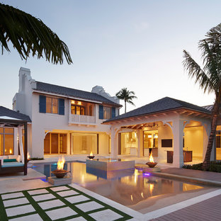 Inspiration for a tropical pool in Miami with decking.