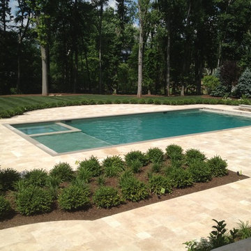 After: Installation of Gunite pool & spa, travertine pool deck and land