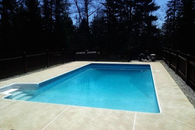 Example of a large backyard rectangular lap pool design in Portland Maine