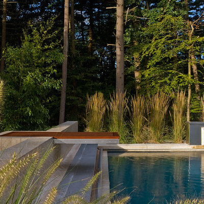 Inspiration for a large contemporary backyard rectangular and concrete pool fountain remodel in Boston