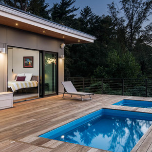 Design ideas for a scandinavian rectangular pool in Other with a hot tub and decking.
