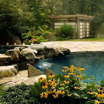 Asian Inspired Free Form Pool with Raised Spa and Waterfall Features