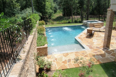 Example of a large transitional courtyard custom-shaped and stone natural hot tub design in Atlanta