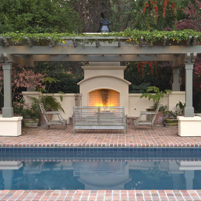 Elegant brick and rectangular pool photo in San Francisco