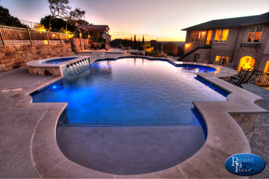 Inspiration for a huge contemporary pool remodel in Austin