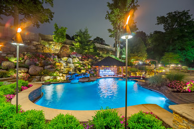 Pool fountain - contemporary backyard pool fountain idea in Philadelphia