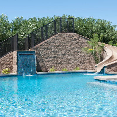 Inspiration for a mid-sized contemporary backyard concrete paver and rectangular water slide remodel in Phoenix