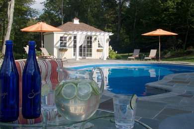 Example of a large classic pool design in New York